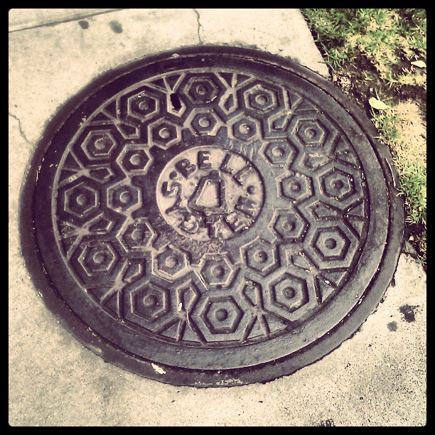 Companies break up, rename & merge, but the stamp on a manhole cover never changes. #mabell #logos #history #branding #phonecompany