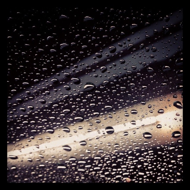 Raindrops on the windshield. #rain #neon #car