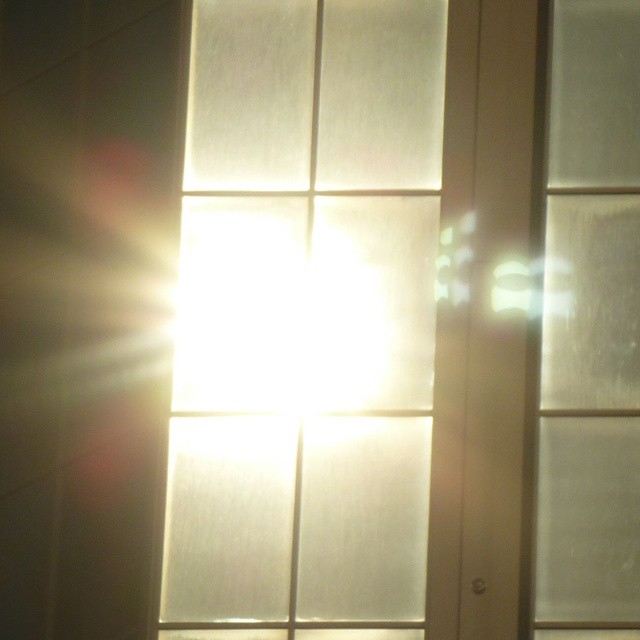 Reflected eclipse, multiple lens flare.