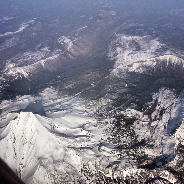 Somewhere over Oregon. Update: I’ve identified the mountain as Mt. Jefferson. #mountains #snow #airplaneshot #cascades #mtjefferson #oregon