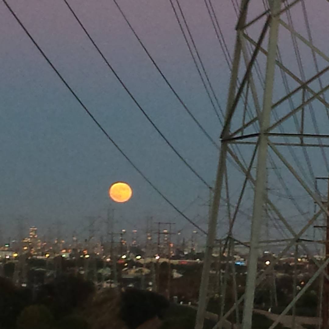 Moonrise over a refinery.