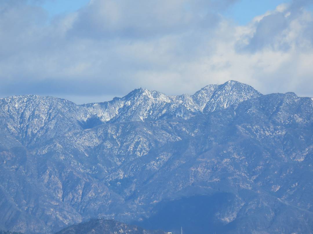 Light snow on the San Gabriel mountains above Los Angeles, just in time for Christmas.