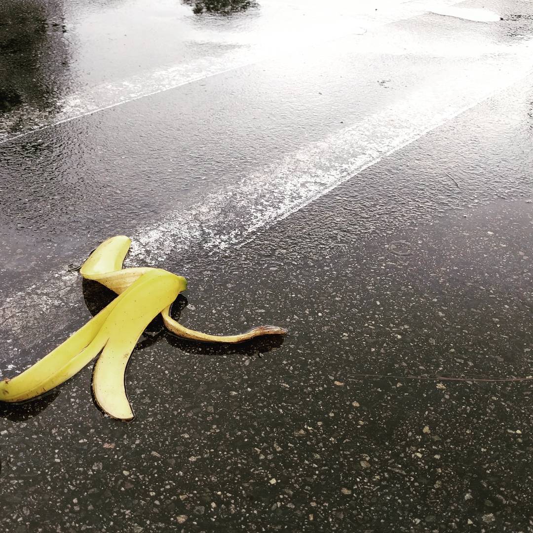 Banana peel on wet ground.